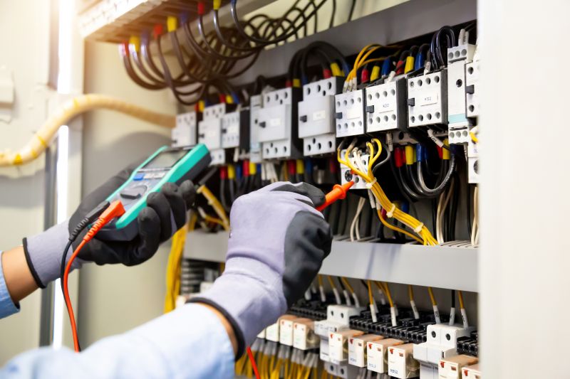 Electrician Installing a Panel